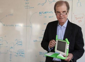 Nicholas Negroponte of the One Laptop Per Child project with one of the XO laptops. Photo: AP